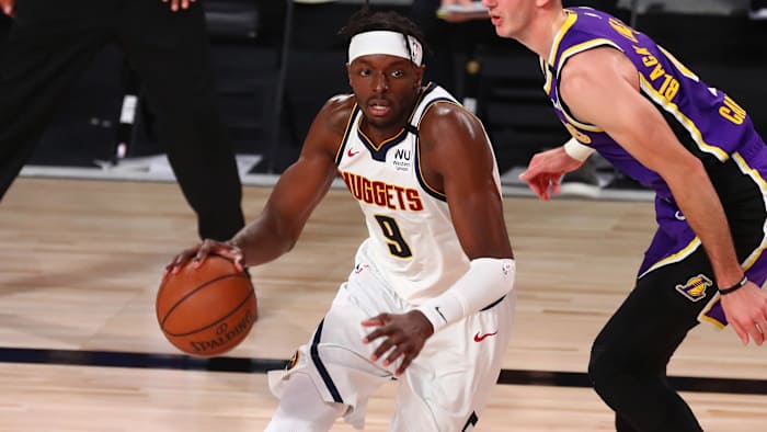 Denver Nuggets forward Jerami Grant (9) drives past Los Angeles Lakers guard Alex Caruso (4) during the first half in game five of the Western Conference Finals of the 2020 NBA Playoffs.